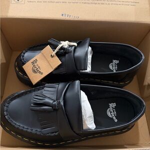 Dr. Martens Black Leather Adrian Quad Platform Loafers
Unisex